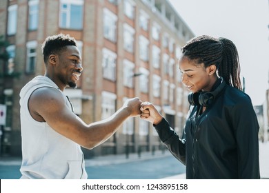 Fitness partners doing a fist bump