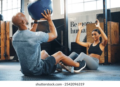 Fitness, personal trainer and exercise with medicine ball, sit ups and throw to partner to workout abdominal muscle. Man, woman and training equipment for core strength, help and body health in gym - Powered by Shutterstock