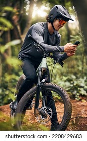 Fitness, Phone And Forest Cyclist In Nature And Sustainability New Zealand Woods With Gps Location, Health Data And Tracking App. Smile, Happy And Training Sports Biker With Helmet And 5g Mobile Tech