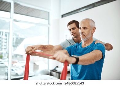 Fitness, physiotherapist and mature man with resistance band in clinic for physical therapy, support or mobility exercise. Health, male doctor and patient for help, stretching arms or rehabilitation - Powered by Shutterstock