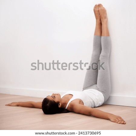Fitness, pilates and girl stretching on wall with relax for health, wellness and training challenge on floor. Gym workout, exercise and woman in warm up to lose weight, body care and development.