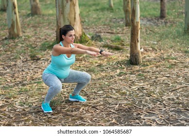 Fitness Pregnant Woman Doing Squats For Strengthen Pelvic Floor Muscles And Legs. Healthy Pregnancy Exercise.