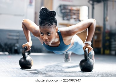 Fitness, push up or black woman with kettlebell for training, body workout or exercise at health club. Motivation, mindset or African girl sports athlete exercising with focus or resilience at gym - Powered by Shutterstock