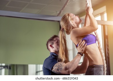 Fitness rope climb cxercise In gym with trainer. - Powered by Shutterstock