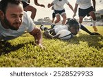 Fitness, rugby and scoring with team of people outdoor on field together for competition or challenge. Exercise, sports and training with player group on grass for goal, points or try in game