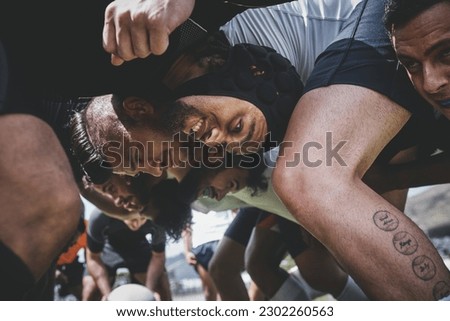 Fitness, rugby and team in a scrum on a field during a game, workout or training in a stadium. Sports, performance and group of athletes in position on an outdoor pitch for a match or practice. [[stock_photo]] © 