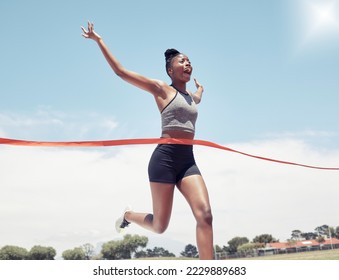 Fitness, runner winner or black woman at finish line for victory, celebration or sport exercise at stadium. Health, winning or running girl for sport, training or workout success for race or marathon