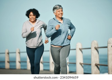 Fitness, running and senior women at beach for health, wellness and exercise in nature together. Elderly, friends and ladies at sea happy, workout and active retirement, fun and bonding ocean run - Powered by Shutterstock