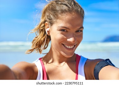Fitness, selfie and happy woman at beach workout, exercise and healthy lifestyle with music. Portrait female athlete, ocean and taking photograph for social media, sports wellness and summer training - Shutterstock ID 2230795111