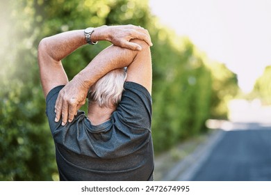 Fitness, senior and man stretching arm in street for morning workout, routine or warm up. Back, lens flare and elderly person for muscle flexibility, running exercise or getting ready in London - Powered by Shutterstock