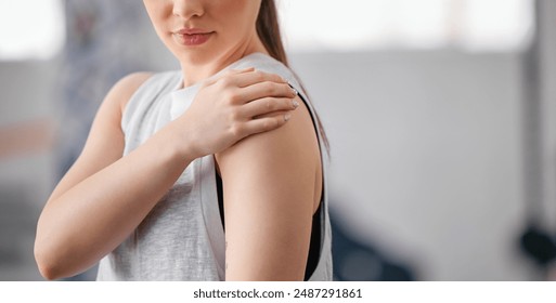 Fitness, shoulder pain and hands of woman with injury from workout, training and exercise accident in gym. Arm, sports and athlete with bone inflammation, arthritis and muscle problem at health club