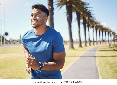 Fitness, smile and a man or runner outdoor for exercise, training or running at a park. Happy Indian male athlete in nature for a workout, run and cardio performance with a watch for progress or goal - Powered by Shutterstock