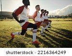 Fitness soccer, men and stretching with sport team on sports field training, exercise or workout. Athlete, group or teamwork in diversity, teamwork and collaboration on warm up for football game