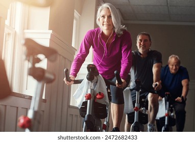 Fitness, spinning class and senior people in gym for cycling, exercise and training with physical activity. Workout club, men and woman on bicycle for health, wellness and endurance with cardio - Powered by Shutterstock