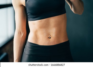 Fitness, Sport And Active Lifestyle. Motivation. Intensive Work Out. Sweaty Muscular Body Of Sporty Woman, Close Up