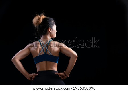 Similar – Image, Stock Photo Rear view portrait of one young middle age athletic woman at crossfit training, exercising with trx suspension fitness straps over dark background