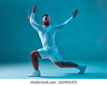 Fitness sport club advertising. Athletic guy training, does lunges exercise. Long exposure, motion blur. Burning workout - Powered by Shutterstock