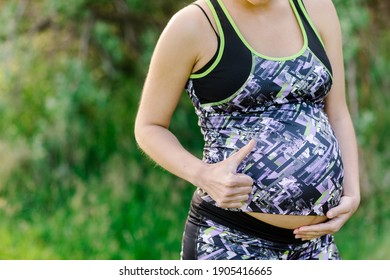 Fitness And Sport During Pregnancy. Pregnant  Sportive Woman. Pregnant Girl Outdoors. Healthy Pregnancy.