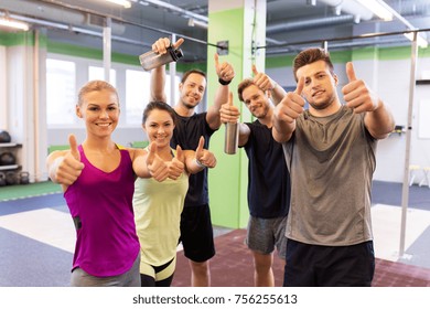 Fitness, Sport, Exercising And Healthy Lifestyle Concept - Group Of Happy People In Gym Showing Thumbs Up