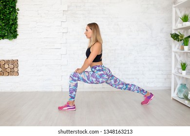 Fitness sport girl in fashion sportswear doing yoga leg fitness exercise 