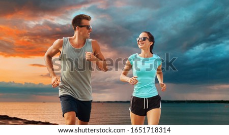 Similar – Image, Stock Photo Young man and woman relaxing in the bar and having drinks. Nightlife and hanging out