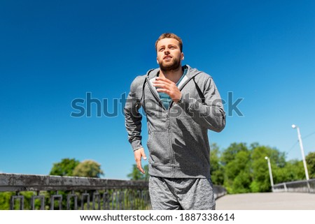 Similar – Image, Stock Photo runner running across the field with his dog