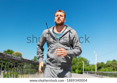 Similar – Image, Stock Photo runner running across the field with his dog