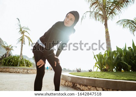 Similar – Strong Man Stretching Calf and Leaning on Wall