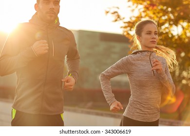 fitness, sport, people and lifestyle concept - couple running outdoors - Powered by Shutterstock