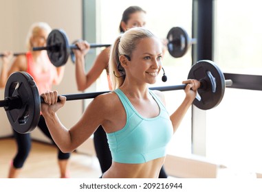 Fitness, Sport, Training And Lifestyle Concept - Group Of Women With Barbells In Gym