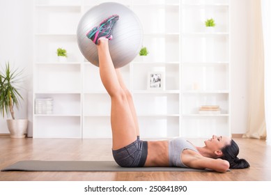 Fitness, Sport, Training And Lifestyle Concept. Pretty Woman With Exercise Ball At Home.