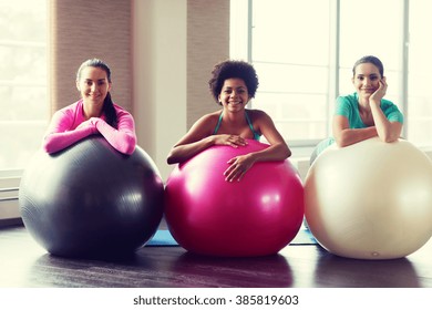 fitness, sport, training and lifestyle concept - group of smiling women with exercise balls in gym - Powered by Shutterstock