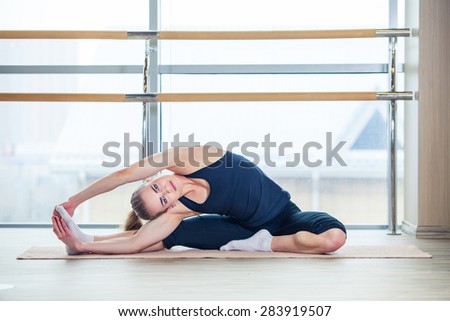 fitness, sport, training and lifestyle concept -  woman doing exercises on mat in gym