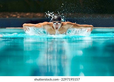 Fitness, sport and training with man in swimming pool for competition, workout and energy. Strong, water splash and cardio with male swimmer and practice for athlete, championship and race at gala