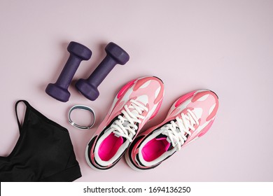 Fitness Sports Equipment And Sneakers On A Pink Background.  Home  Workout. Top View, Flat Lay