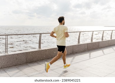 Fitness sports and warm-up in every day and workout. Trainer exercise jogging. A runner runs in fitness clothes. - Powered by Shutterstock