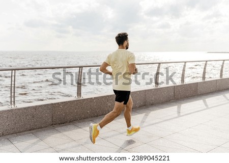 Fitness sports and warm-up in every day and workout. Trainer exercise jogging. A runner runs in fitness clothes.