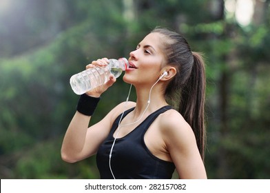 fitness sporty woman running early in the morning in forest area, healthy lifestyle concept - Shutterstock ID 282157082