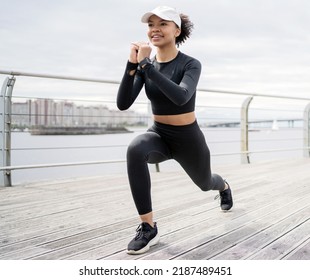 Fitness time a female athlete is running doing an active workout on the street. Uses the smartwatch app on your hand - Powered by Shutterstock