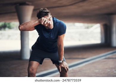 Fitness, tired and man with sweat in outdoor for running challenge, exhausted or marathon training. Breathing, sports and male athlete with break for workout fatigue, cardio exercise or resting - Powered by Shutterstock