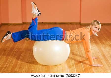 Fitness trainer on a fitball