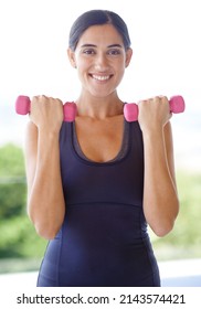 Fitness Waits On Nobody. Portrait Of A Young Woman Lifting Weights Outside.