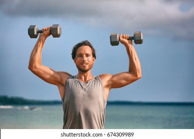 Fitness Weightlifting Man Doing Shoulder Press. Gym Workout Lifting Dumbbell Weights. Male Athlete With Muscular Arms With Dumbbells Overhead Training Biceps.