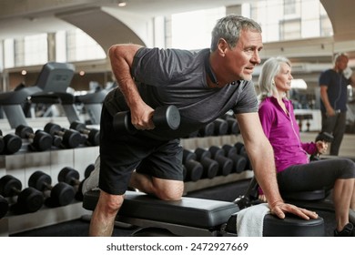 Fitness, weights and senior man in gym for workout, training and cardio exercise for healthy body. Retirement, sports and person with dumbbell equipment for wellness, muscle strength and mobility - Powered by Shutterstock