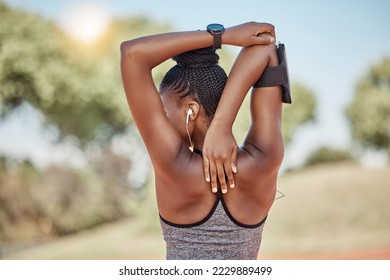 Fitness, wellness or black woman stretching arm for exercise warm up, cardio workout or training at nature park. Back view, runner or athlete girl with health stretch, sports or running marathon - Powered by Shutterstock