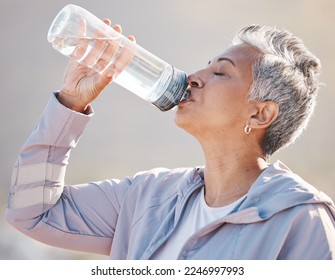 Fitness, wellness and senior runner drinking water for hydration on outdoor run, marathon training or cardio workout. Sports exercise, bottle and profile of thirsty woman running in Miami Florida USA - Powered by Shutterstock