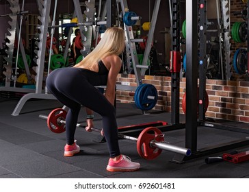 Fitness Woman Doing A Dead Lift In The Gym