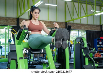 Fitness woman doing exercise, athletic girl workout in gym. Concept of sports, gyms, fitness, bodybuilding, healthy lifestyle. - Shutterstock ID 2159215677