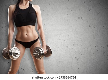 Fitness woman doing exercise with dumbbells. Athletic girl working out - Shutterstock ID 1938564754