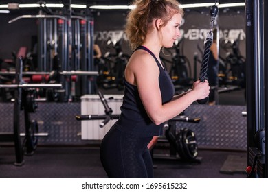 Fitness Woman Doing Exercise Workout Triceps Push Down At Gym.